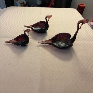 Set of three vintage, hand-blown glass swan dishes in an amethyst purple color.